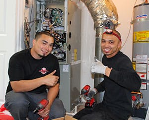 Lead Install Technicians, David Mendoza & Gilbert Caceres installing a new HVAC system in Blackhawk Danville, CA