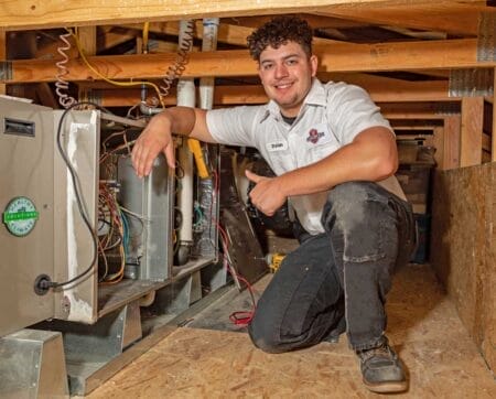 Perfect Star Heating and Air Conditioning Concord, CA Senior Comfort Adviser, Danny Mendoza servicing a client’s furnace in Brentwood, CA Heating Furnace page